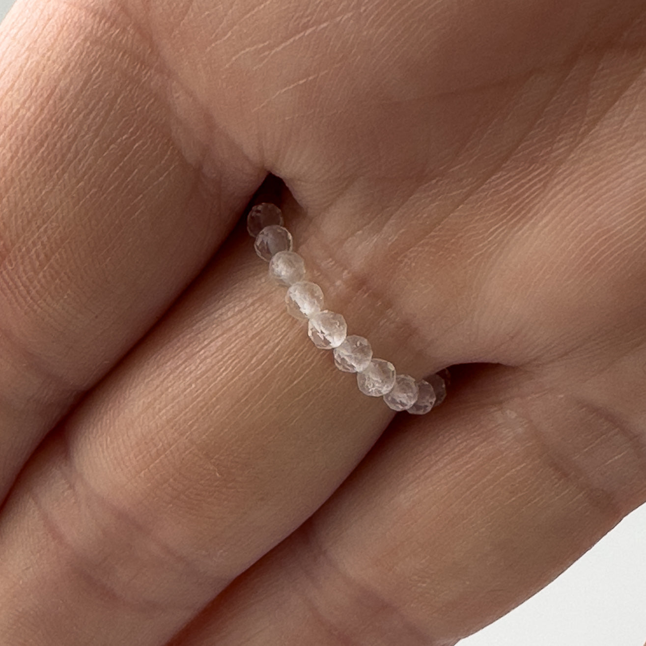 Underside view of Courage Birthstone Healing Crystal ring for Taurus or Aries on finger