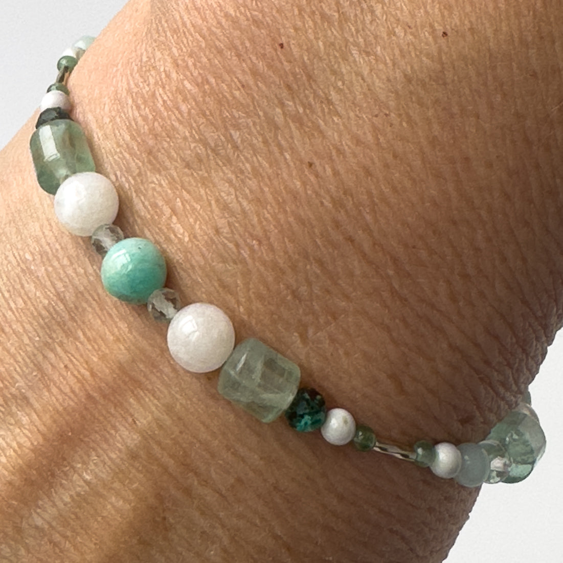 Virgo Healing Crystal bracelet for Anxiety on wrist showing Howlite, Moonstone, Chrysocolla, Green Aventurine, Amazonite and Fluorite