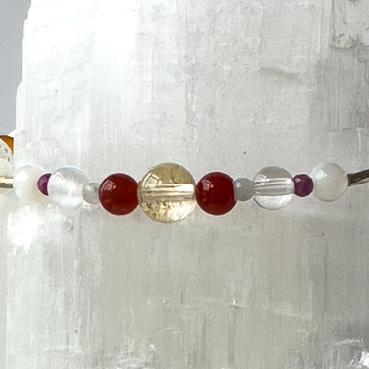 Virgo Birthstone Healing Crystal bracelet for Grief & Loss support showing Carnelian, Amazonite, Citrine, Sugilite, Moonstone, Selenite and Clear Quartz