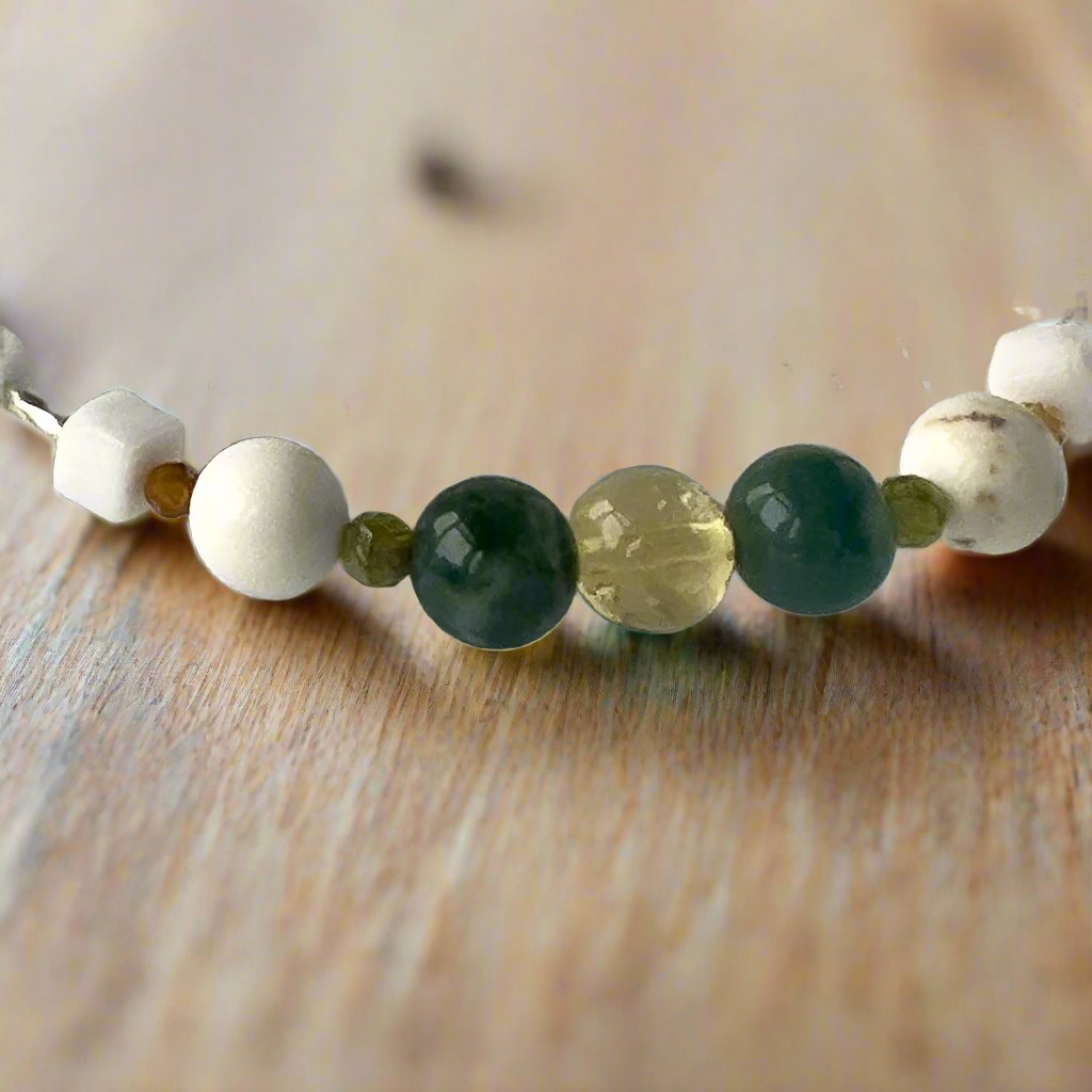Virgo Birthstone Healing Crystal bracelet for Love and Compassion showing Citrine, Peridot, Moss Agate, Garnet, Howlite and Magnesite