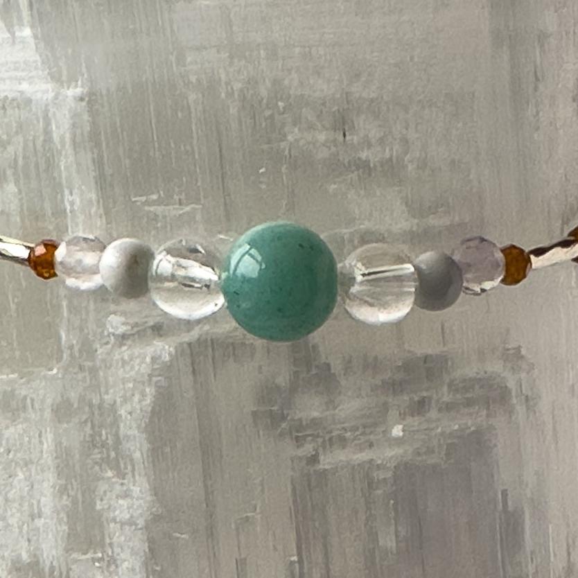 Virgo Birthstone Healing Crystal bracelet for Calm & Stress relief showing Howlite, Amazonite, Rainbow Fluorite, Garnet and Clear Quartz