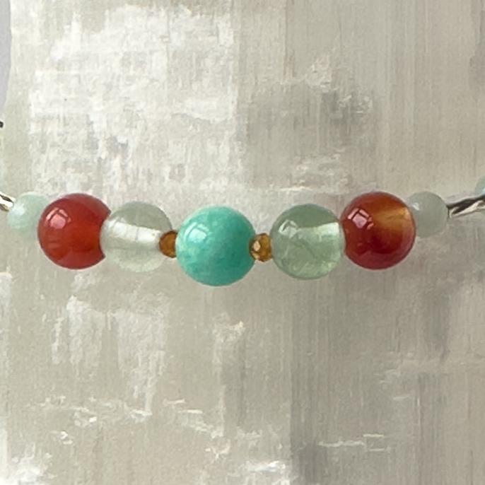 Virgo Birthstone Healing Crystal bracelet for Determination & Willpower showing Sardonyx, Rainbow Fluorite, Garnet and Amazonite